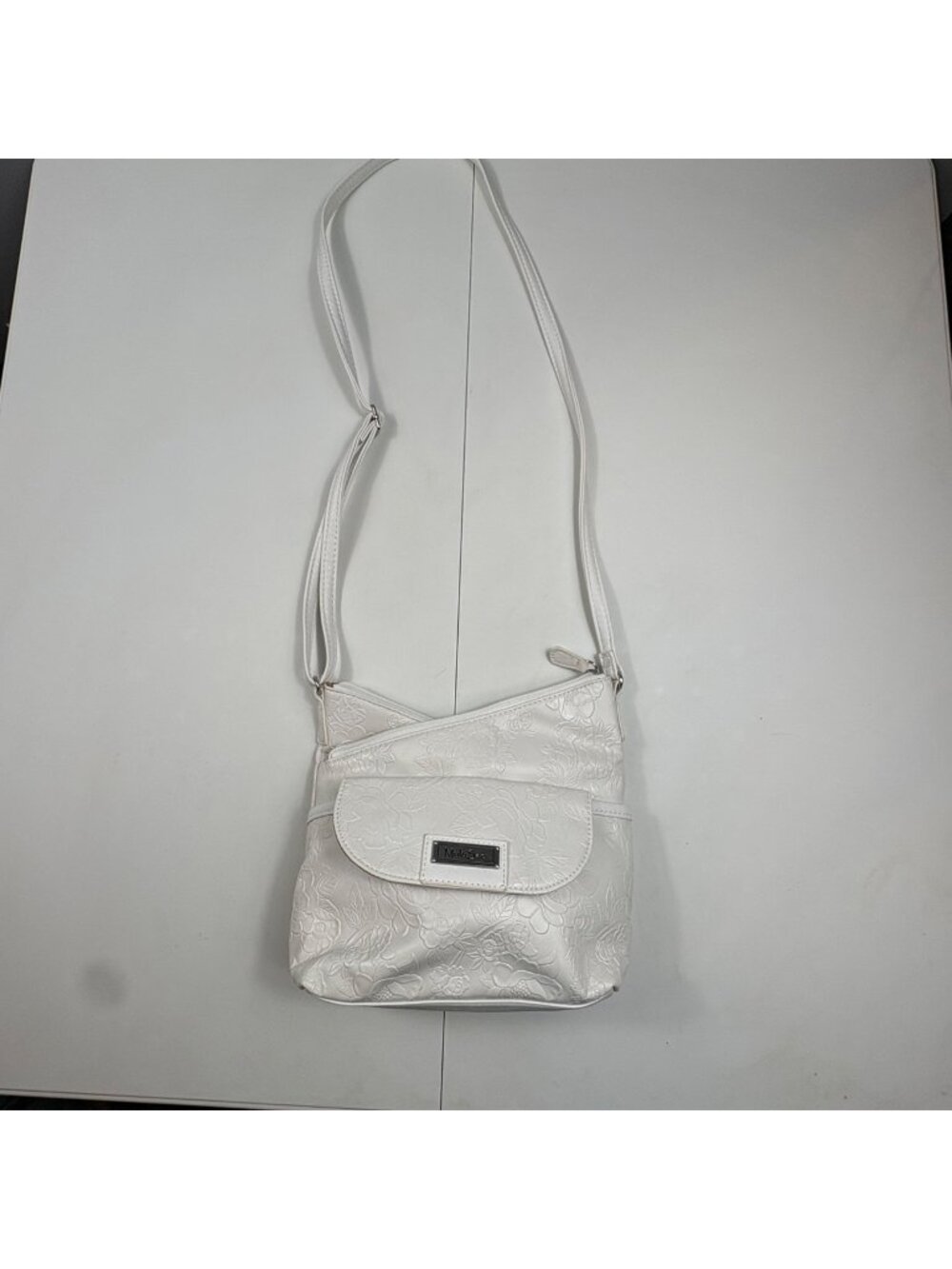 MultiSac White Floral Embossed Crossbody Bag With Adjustable Strap & Multiple Po